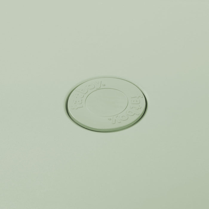 Close-up of Toní’s table by Fatboy in mist green, showcasing its durable aluminum slats for a sleek and weather-resistant finish.