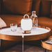 Kooduu Loome: portable LED table lamp with dimmable warm light, 40-hour battery life, and stylish lantern-style design.
