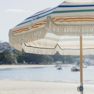 Add a touch of elegance to your outdoor adventures with this stylish beach umbrella.