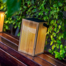 Load image into Gallery viewer, The Okinawa Lantern brings a touch of nature to your garden, featuring a rechargeable bulb, 20-hour battery life, and a harmonious design.
