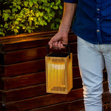 Load image into Gallery viewer, Illuminate your outdoor spaces with the Okinawa Lantern, a handmade bamboo lamp, with a rechargeable bulb, providing up to 20 hours of light.
