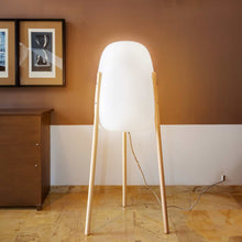 Load image into Gallery viewer, Rocket by Newgarden: A unique floor lamp with wooden legs, perfect for adding a touch of elegance to any space.
